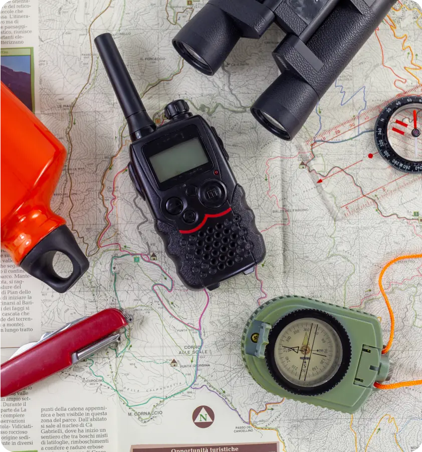 Raven navigation and survival gear on a map